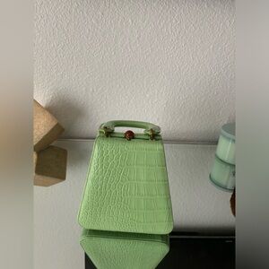 Super stylish mint green Staud handbag.